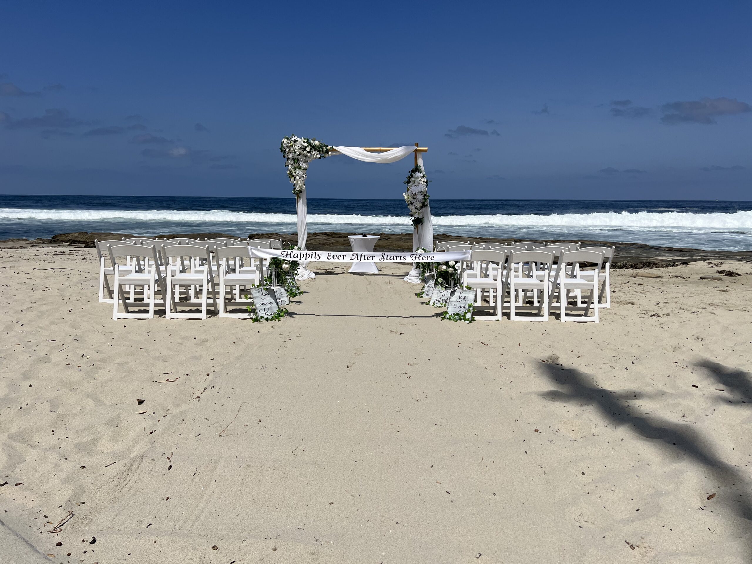 white flowers with bamboo arch